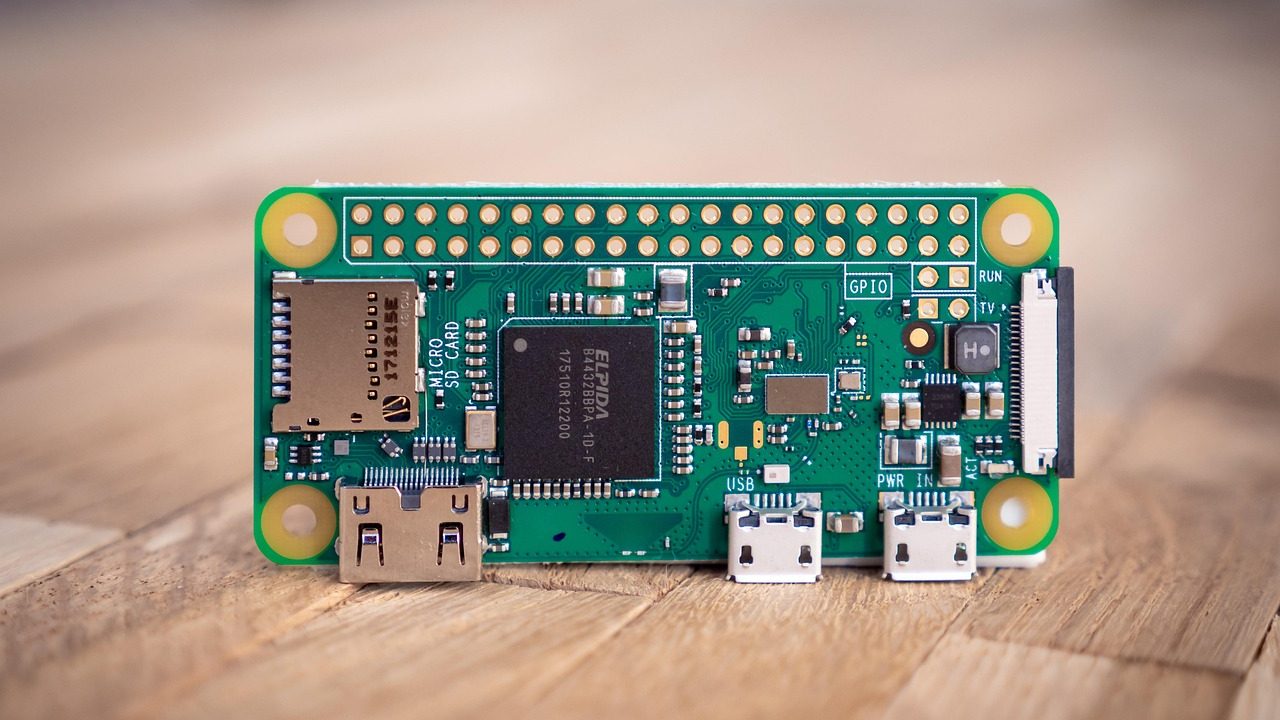 A small Raspberry Pi microcomputer circuit board on a desk.