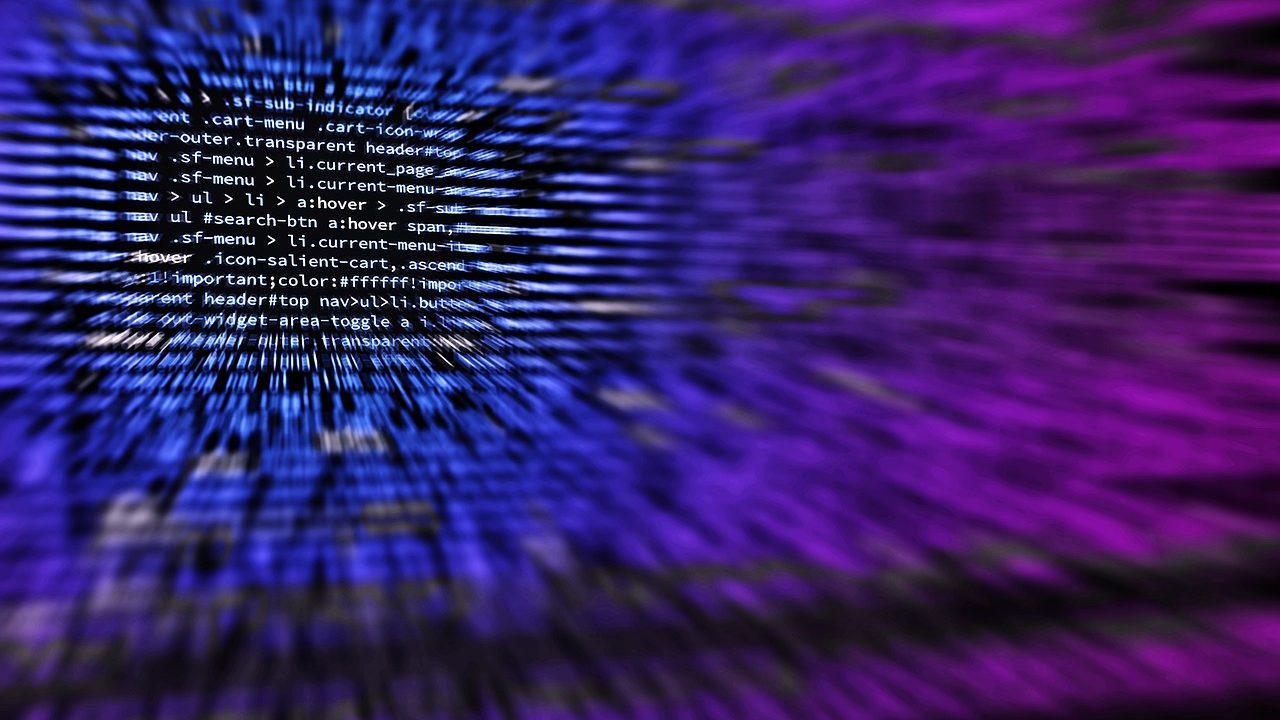 A computer screen displays lines of open-source code in a dark terminal window.