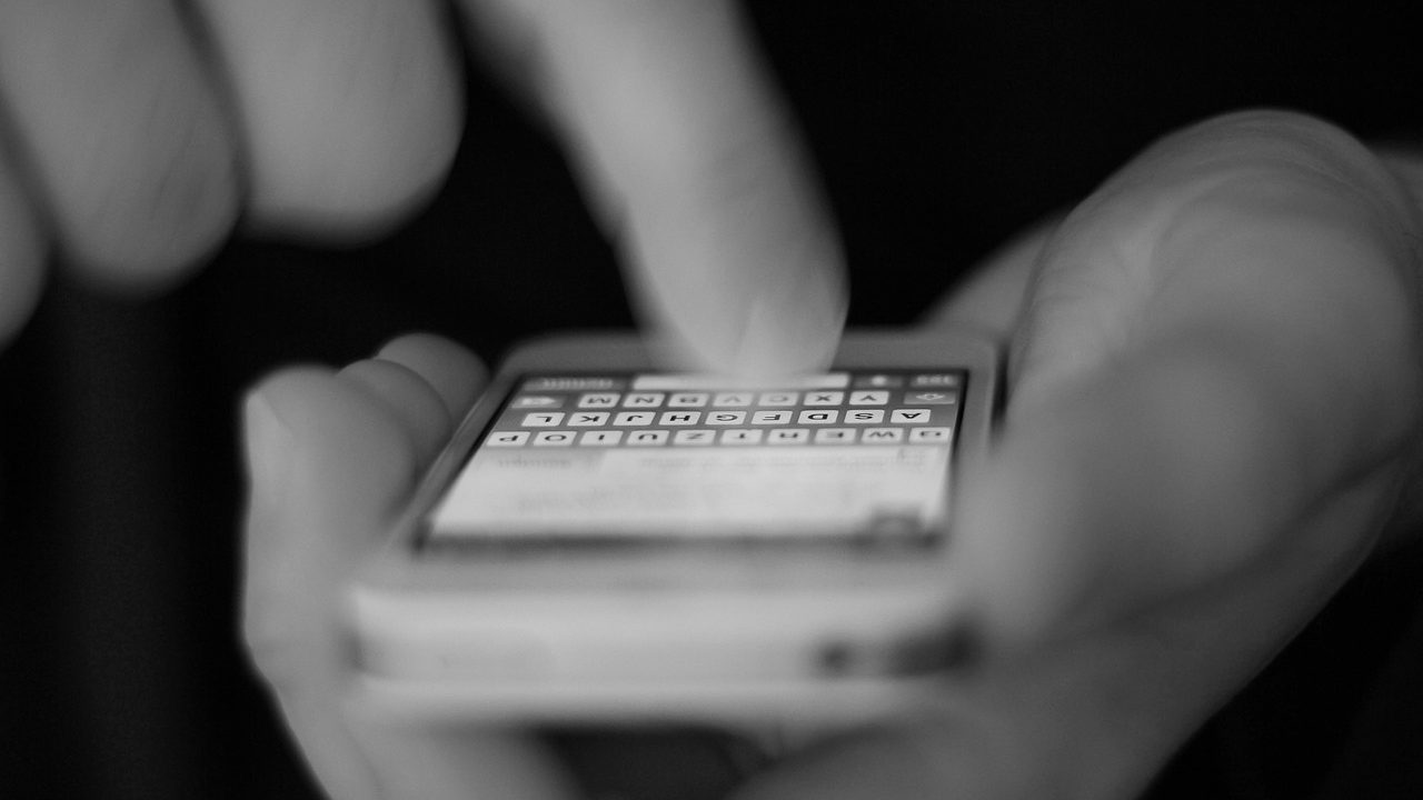 Close-up of a smartphone screen displaying app icons and interface elements.