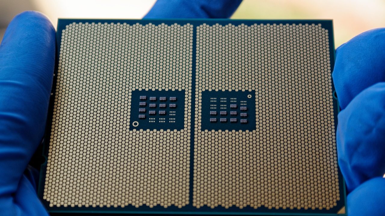 Extreme close-up of a silicon microchip showing intricate circuit pathways and transistors.