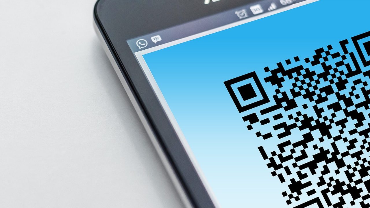 A black and white QR code pattern photographed in close-up detail.