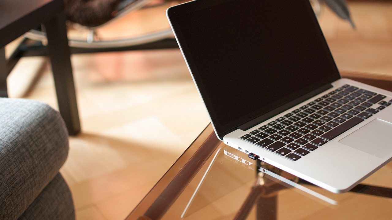 A laptop screen displaying multiple open browser tabs in a modern workspace.
