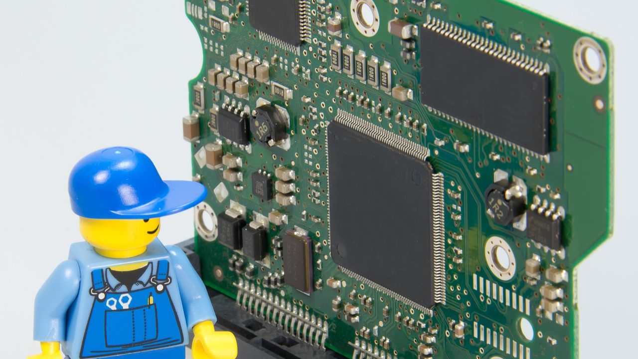 An extreme close-up of a computer processor and circuit board with visible chip architecture.