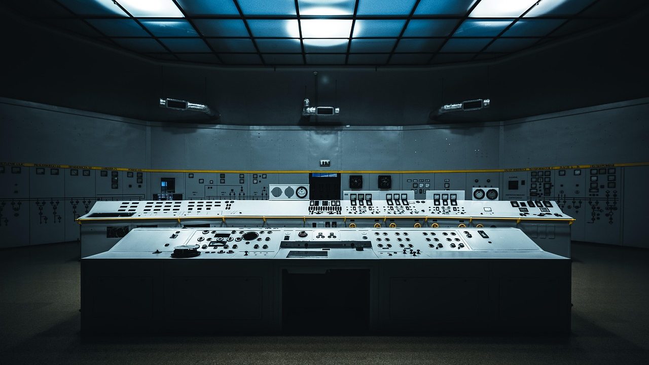 An industrial HVAC and building automation control panel with digital displays and switches.