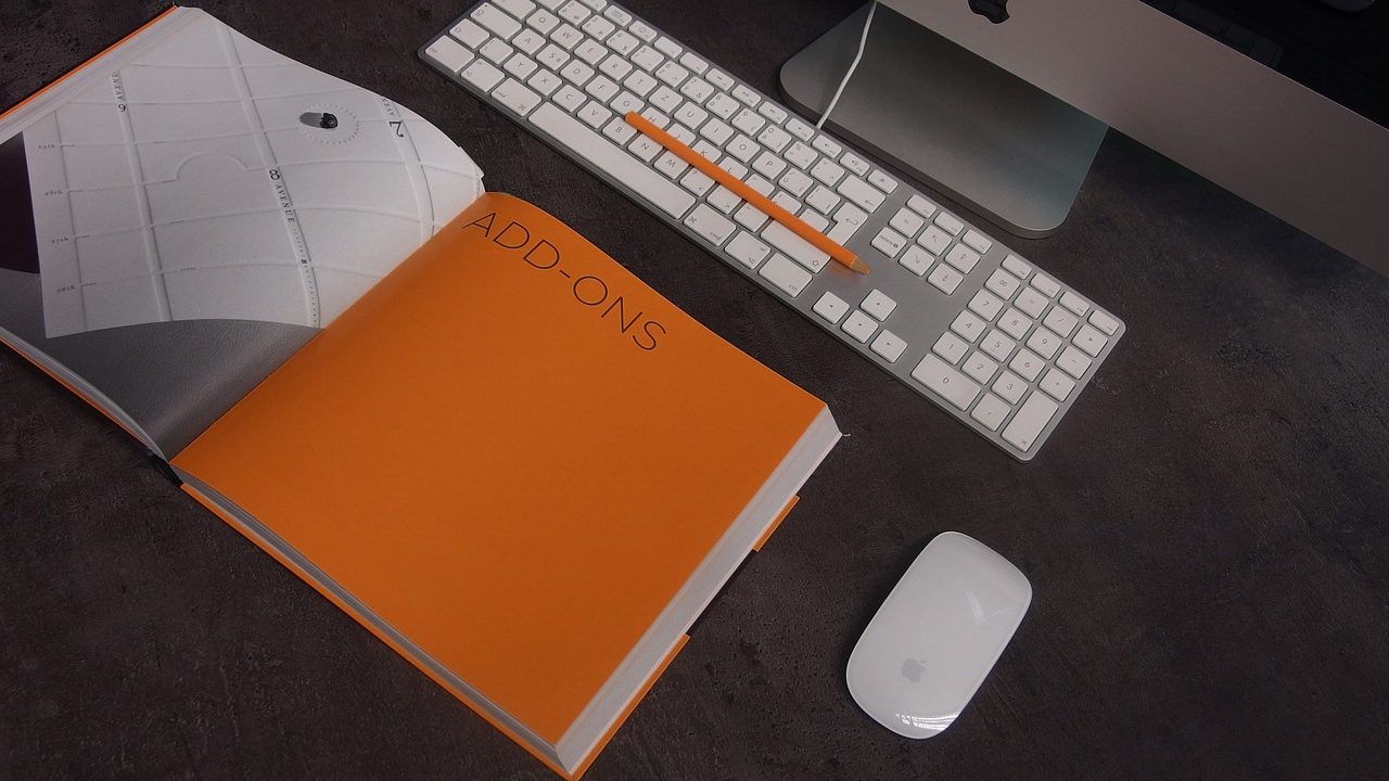 A bright creative studio workspace with blank canvases and scattered art supplies.