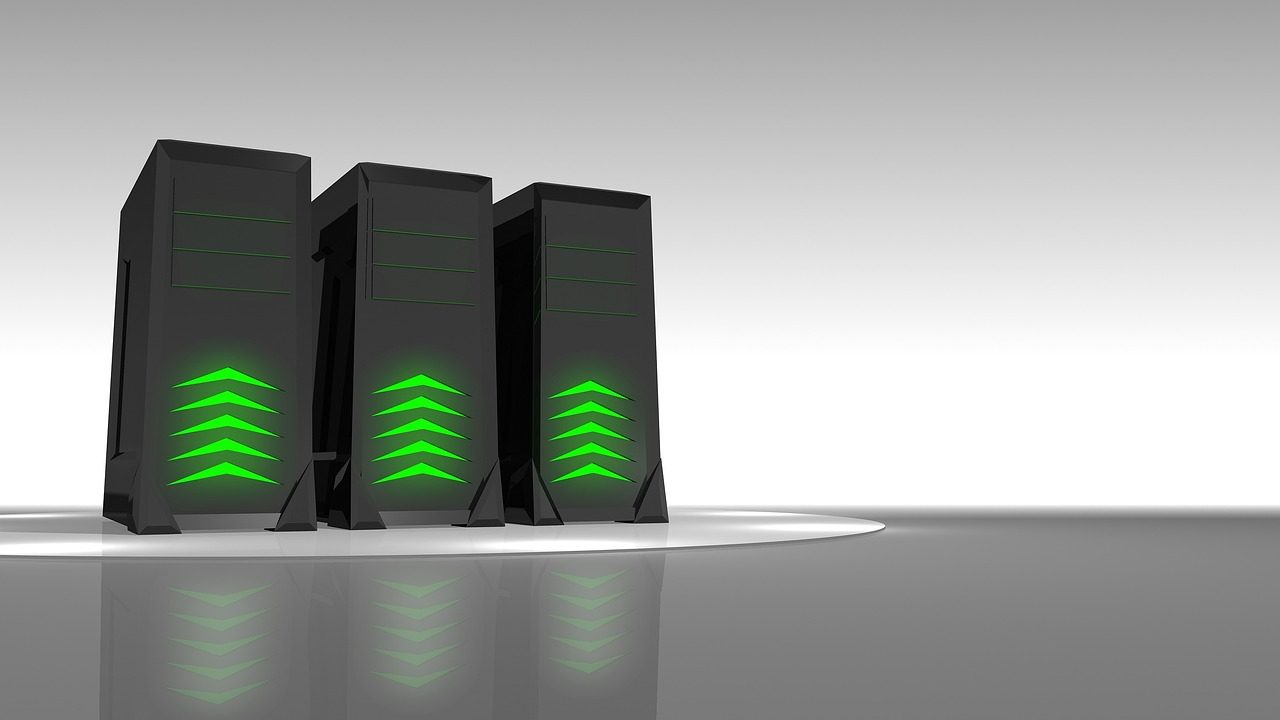 Long corridor of illuminated server racks inside a large data center with blue cooling lights.