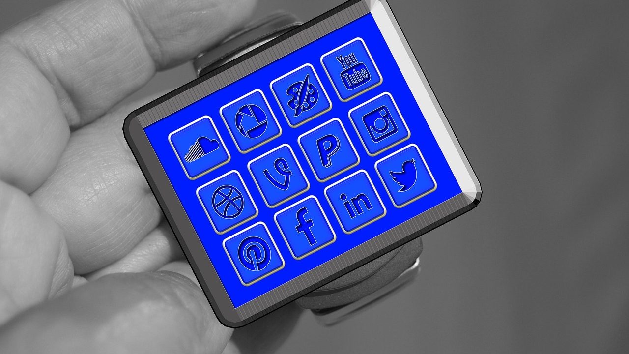 A smartwatch displayed on a wrist against a neutral background.