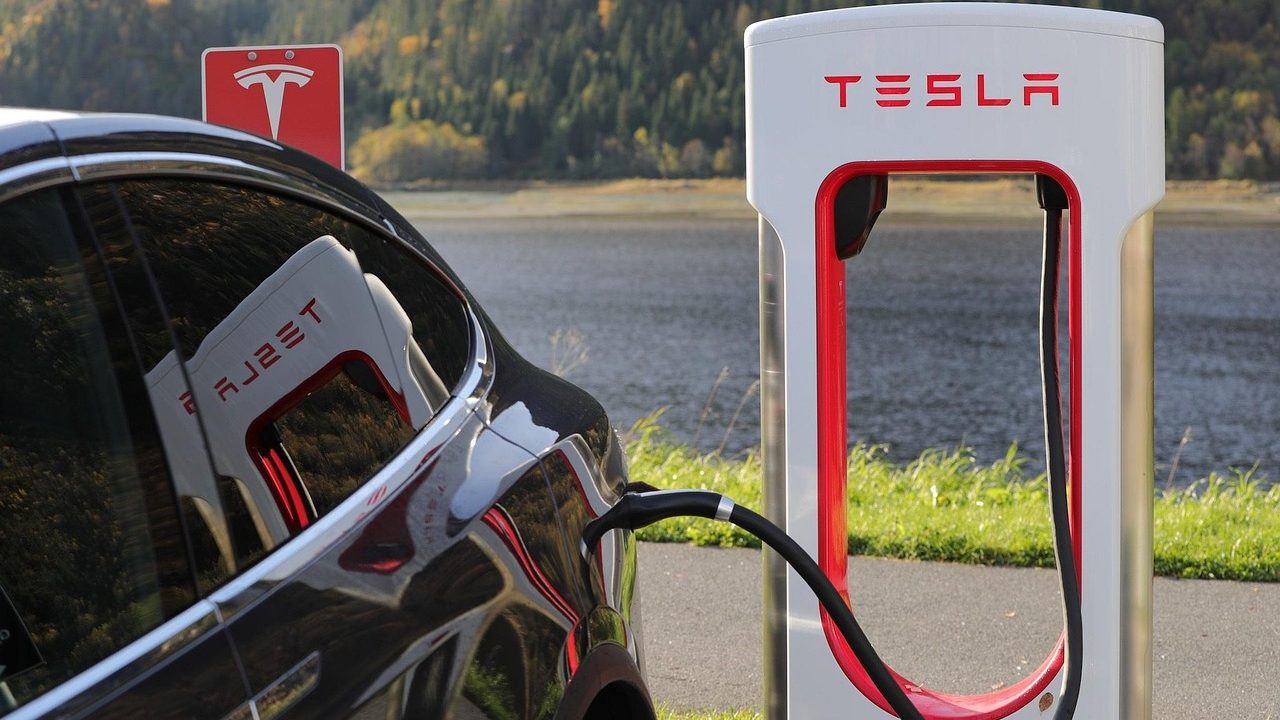 An electric vehicle plugged into a charging station.