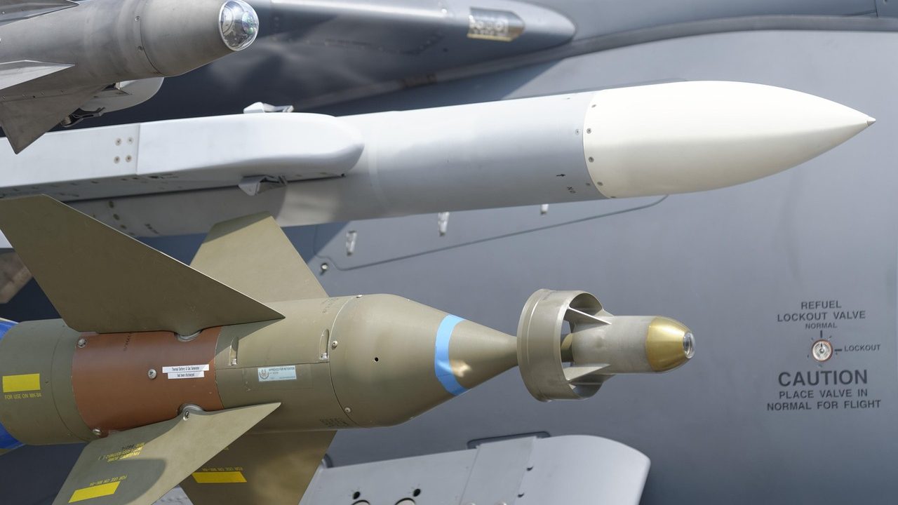 A military missile defense battery with radar dishes against a cloudy sky.