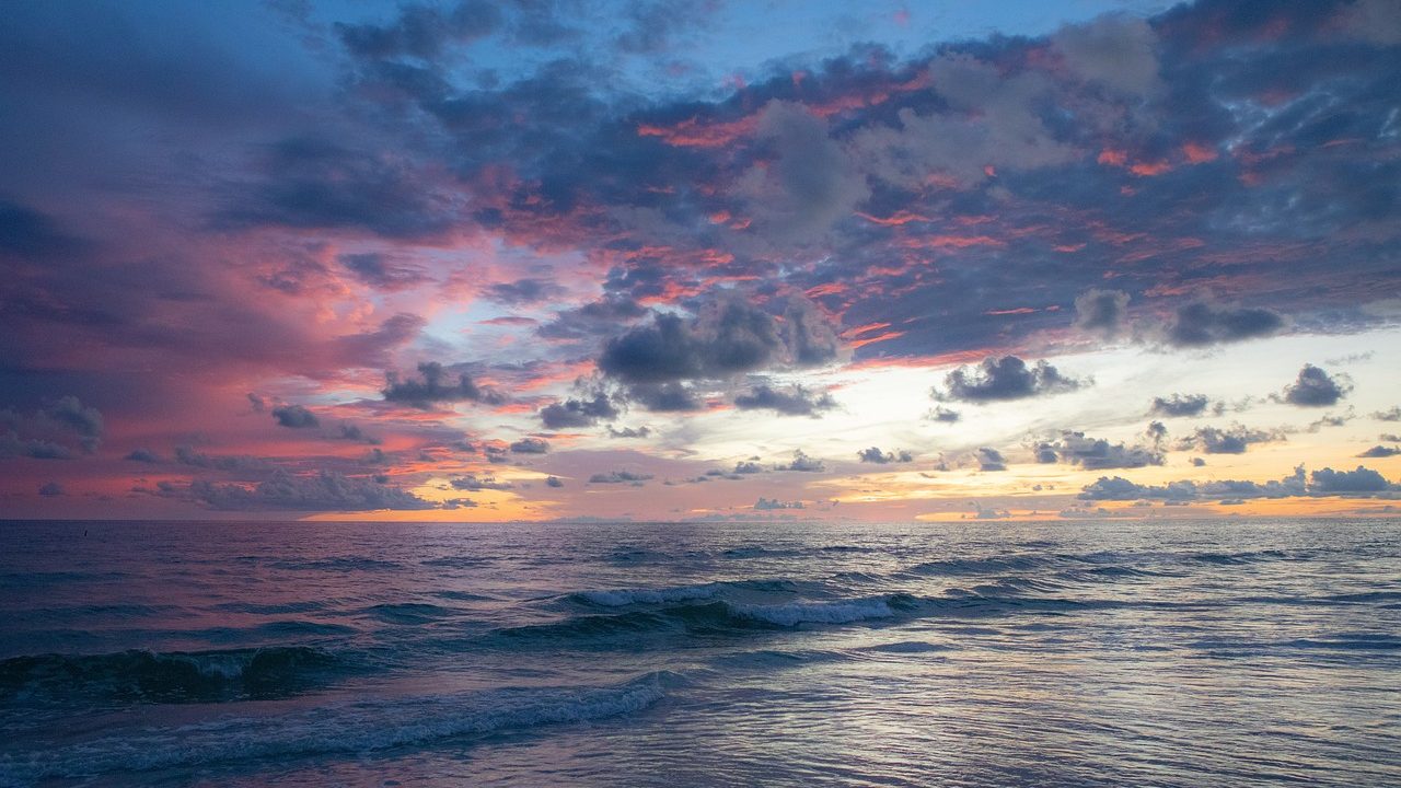Marine layer clouds hanging over a Southern California beach at mid-morning.
