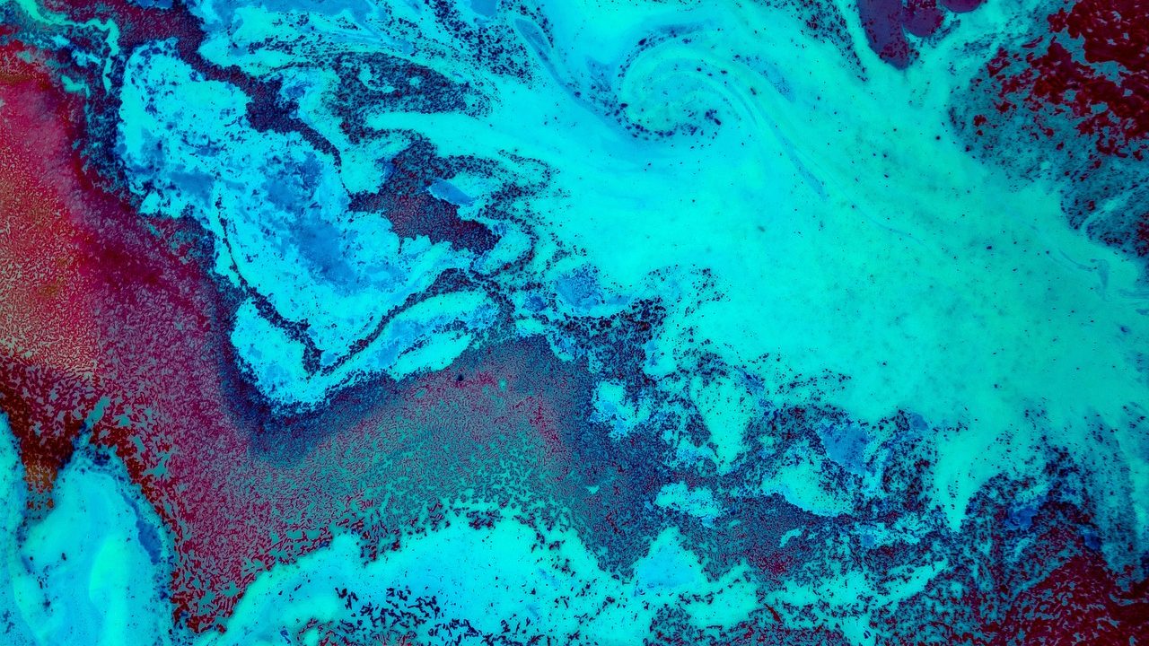 A colorful Doppler radar weather map displayed on a monitor showing storm cell patterns over a coastal region.