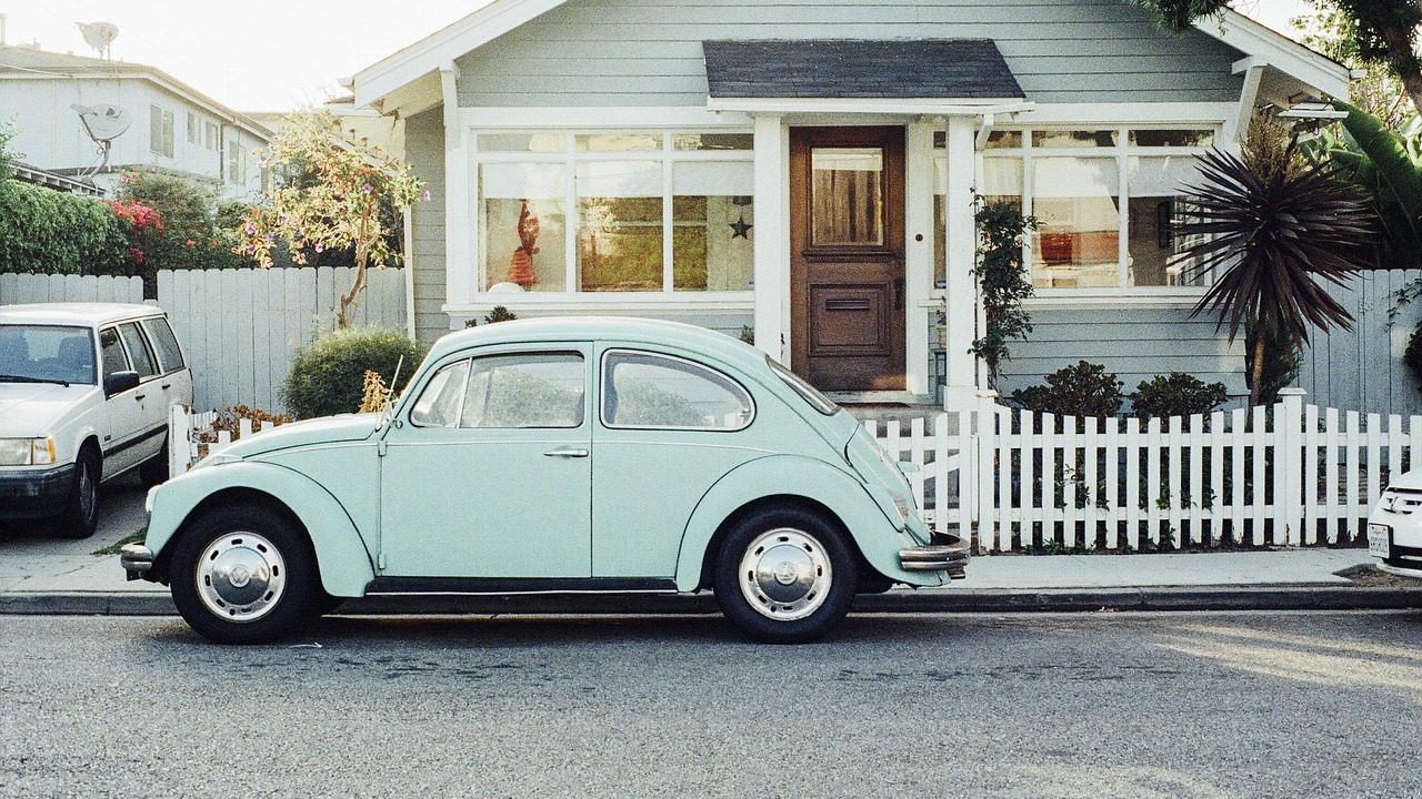 A quiet tree-lined suburban street in Southern California on a sunny day.