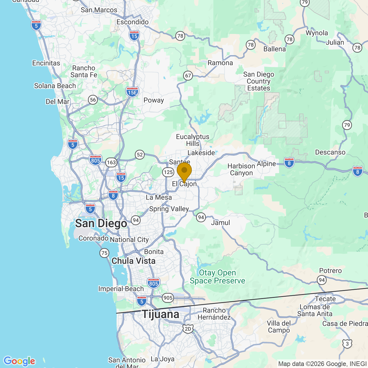 Aerial view of East County San Diego suburban neighborhoods with hills in the background.